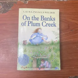 ON THE BANKS OF PLUM CREEK- LURA INGALLS WILDER