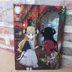 Truyện tranh Shadows House tập 1 tặng kèm postcard, sách bị cấn móp ở góc