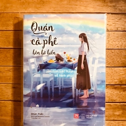 Quán cà phê bên bờ biển kèm poster