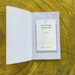 CHINA’S DEVELOPING LEGAL AID SYSTEM 1002596