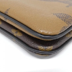 Túi đeo vai Louis Vuitton Monogram Giant Pochette Double Zip M69203 611400