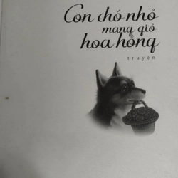 Cuốn sách  "Con chó nhỏ mang giỏ hoa hồng" của tác giả Nguyễn Nhật Ánh. 546358