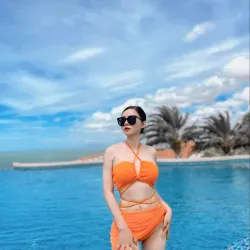 Đồ bơi nữ hai dây màu cam phối dây quấn eo phù hợp đi biển 1024412