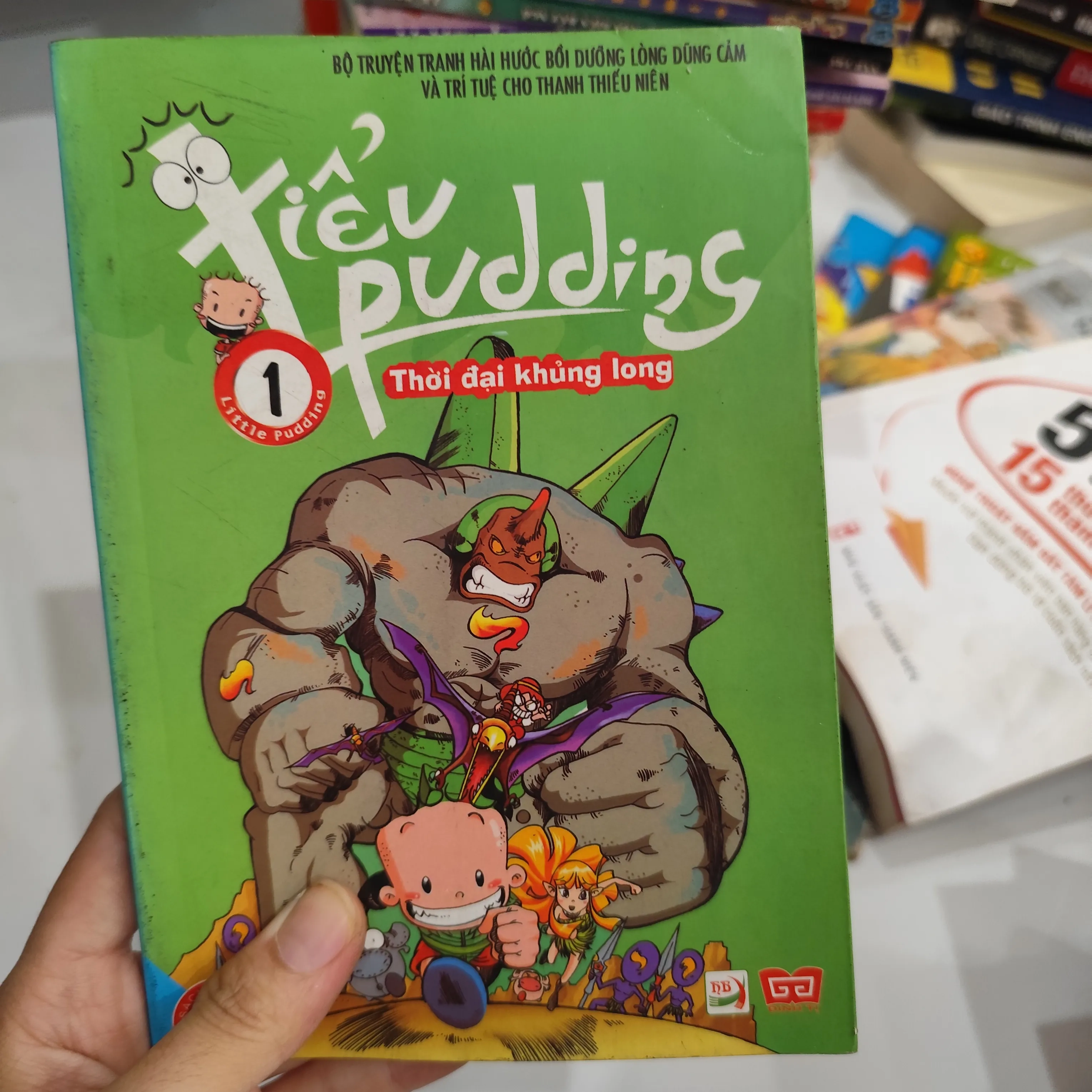 Tiểu Pudding Thời Đại Khủng Long" tập 1. by  - Sách Book Cover - Ngọc Hiển Books