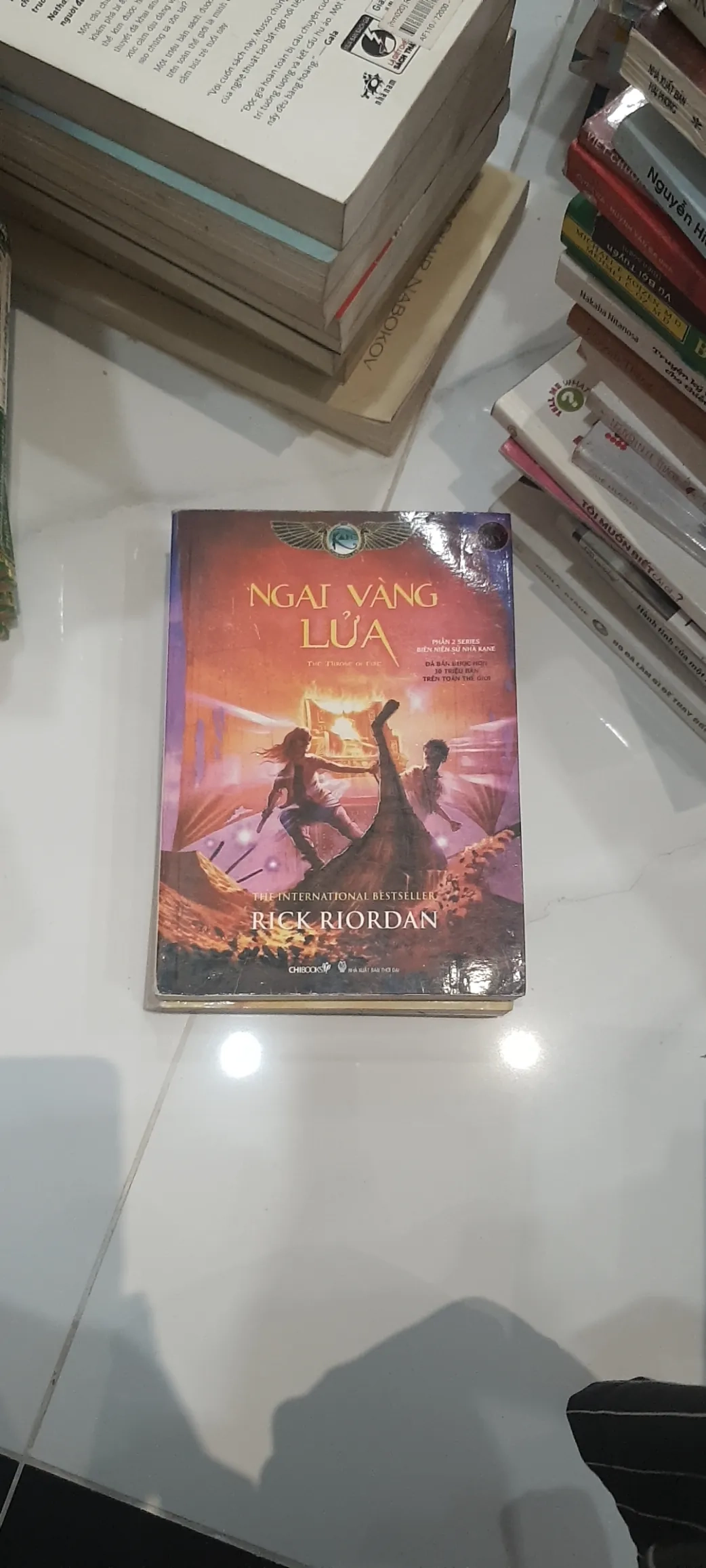 "Ngai Vàng Lửa"  👣 by Rick Riordan - Sách Book Cover - Ngọc Hiển Books
