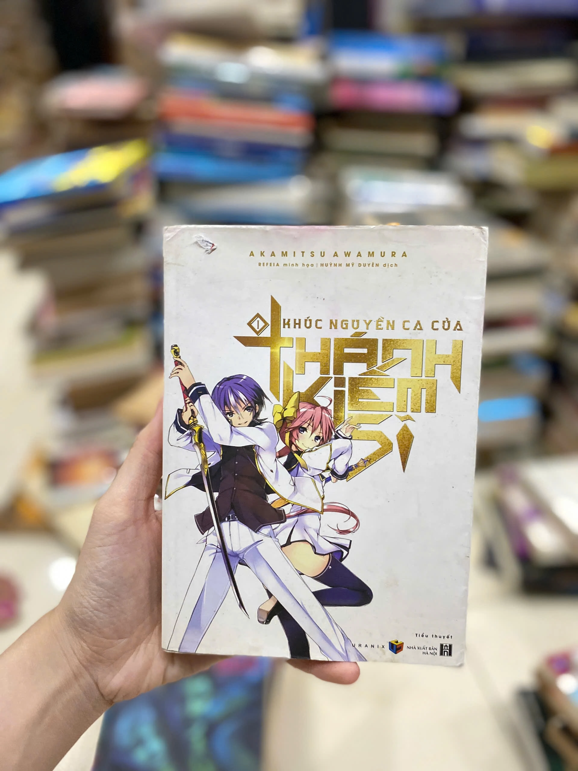 Khúc Nguyền Ca Của Thánh Kiếm Sĩ - Tập 1 by Akamitsu Awamura - Sách Book Cover - Ngọc Hiển Books