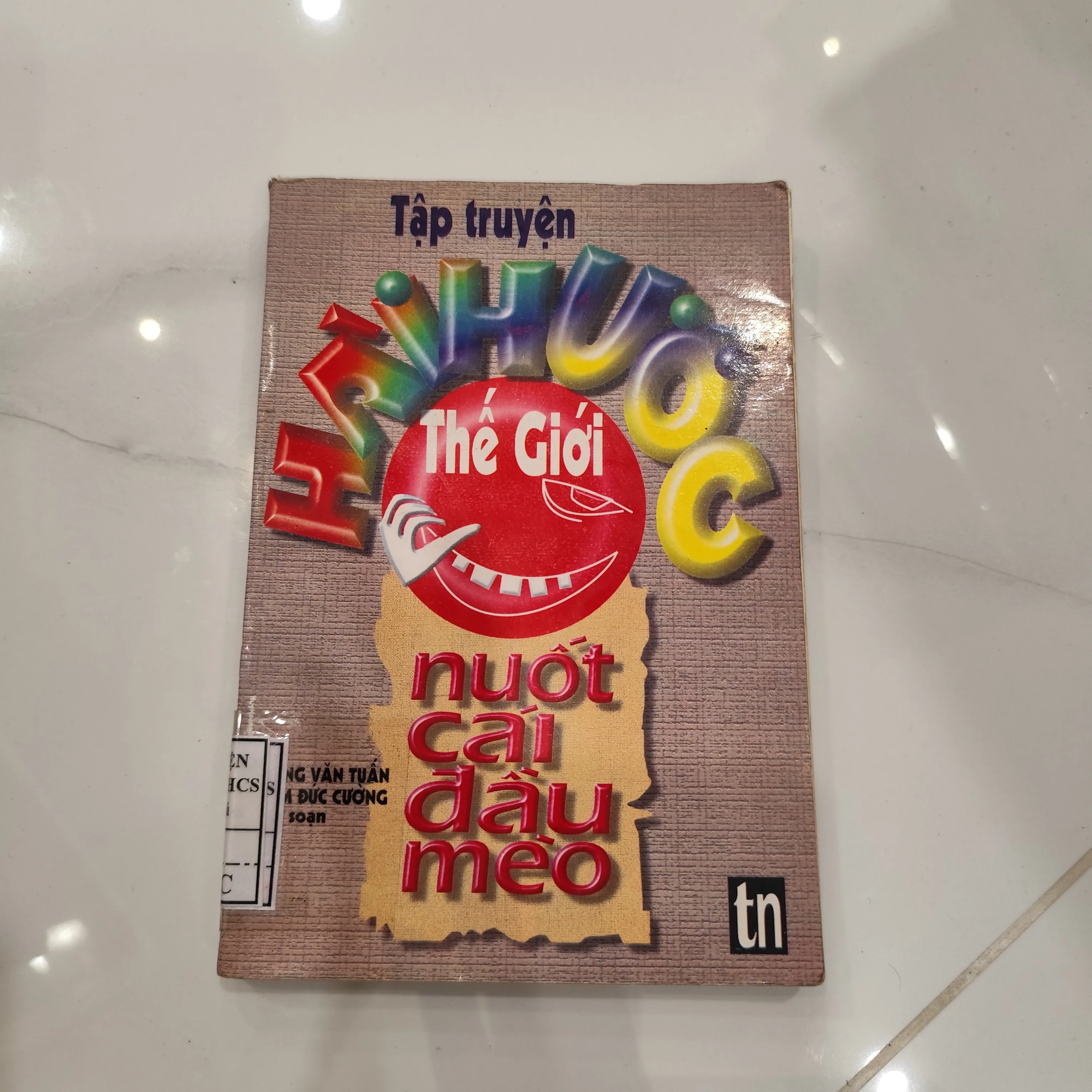 Tập truyện hài hước thế giới - Nuốt cái đầu mèo by  - Sách Book Cover - Ngọc Hiển Books