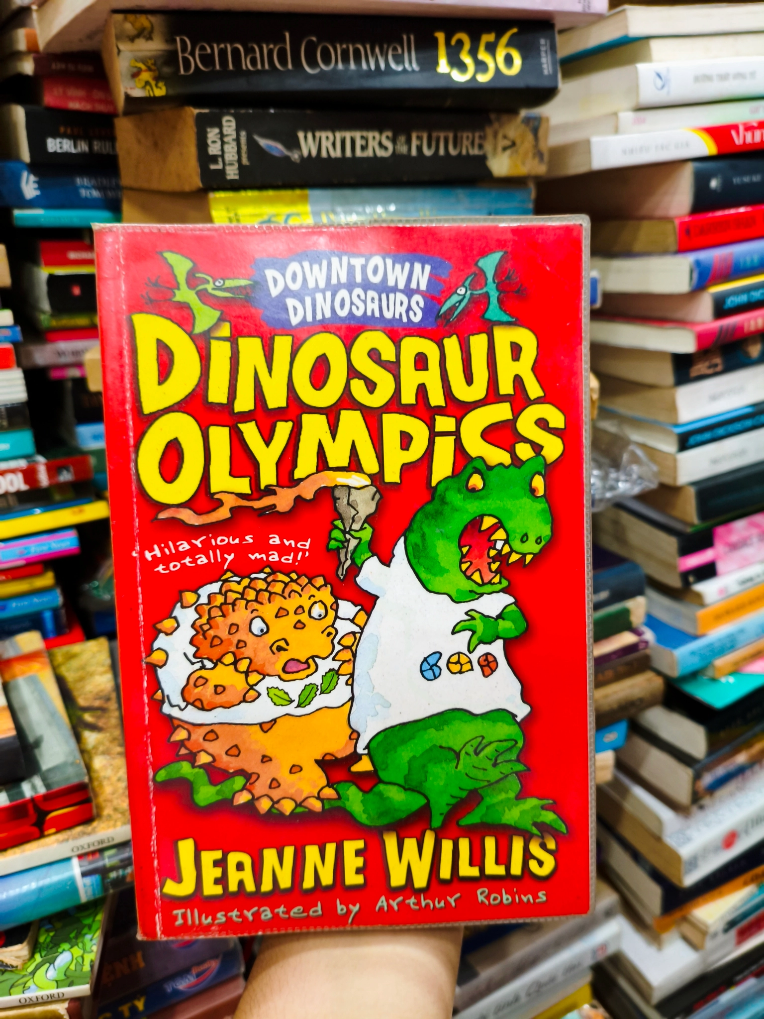 Dinosaur Olympics 🌱 by  - Sách Book Cover - Ngọc Hiển Books