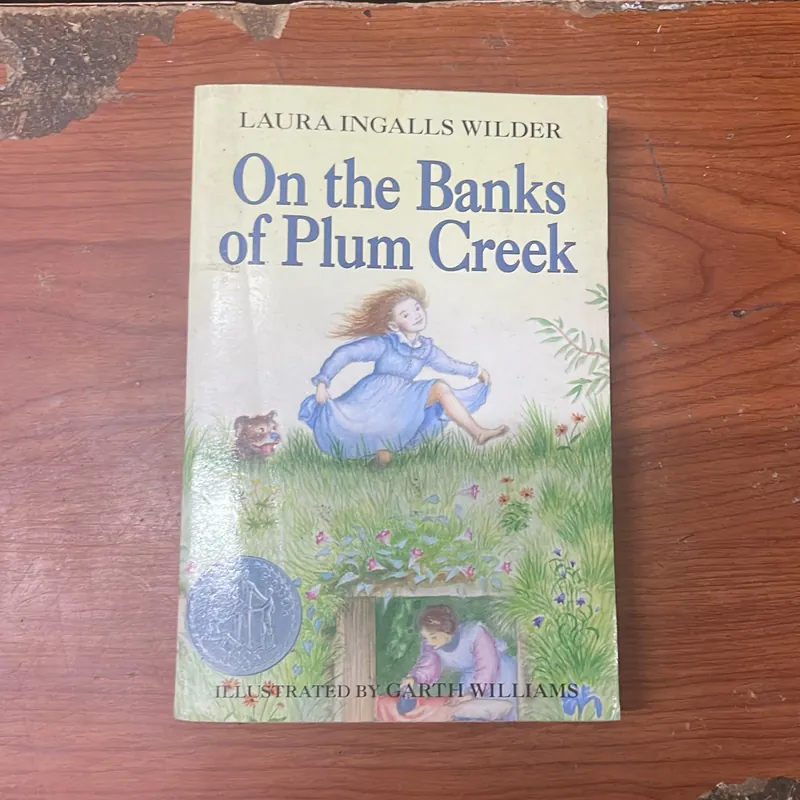 ON THE BANKS OF PLUM CREEK- LURA INGALLS WILDER 674755