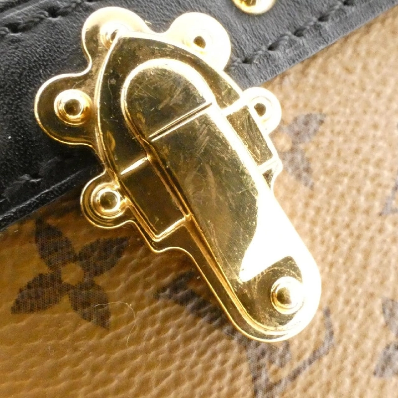 Túi xách vai Louis Vuitton Monogram Reverse Trunk Clutch M43596 610311