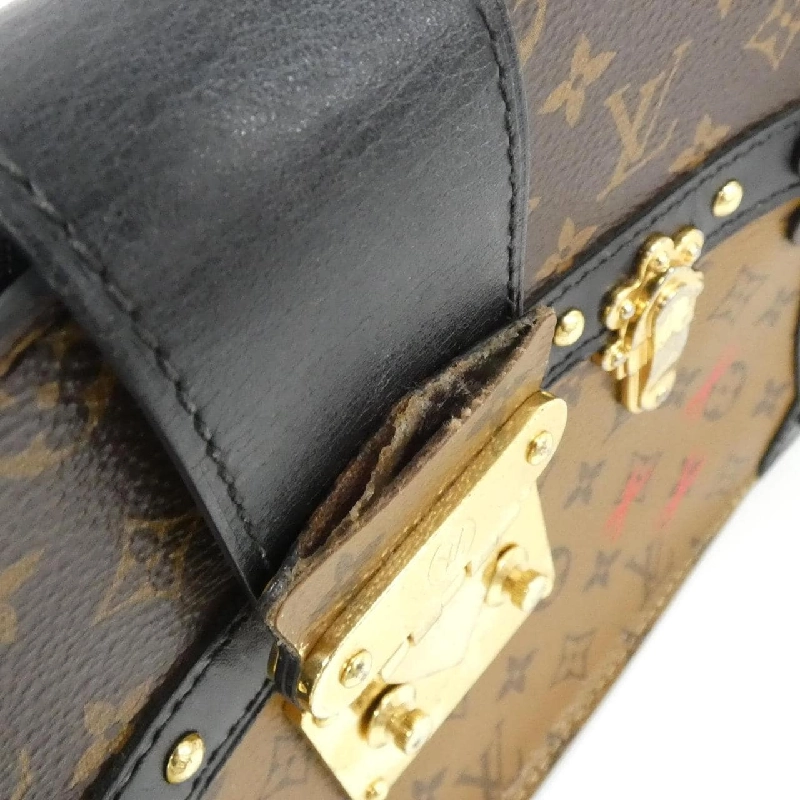 Túi xách đeo vai Louis Vuitton Monogram Reverse Trunk Clutch M43596 611739