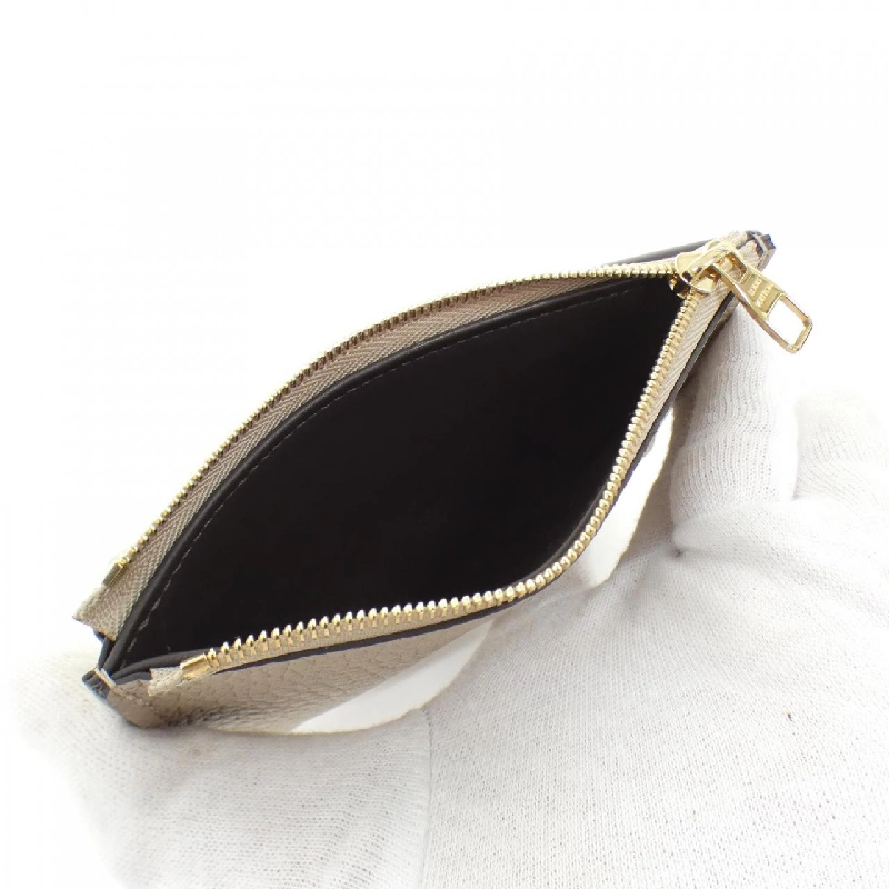 Ví Louis Vuitton Trillon Portefeuille Capucines Compact M62159 623403