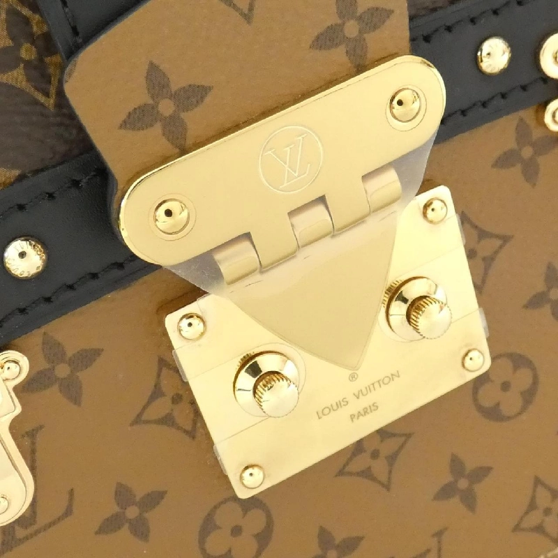 Túi xách đeo vai Louis Vuitton Monogram Reverse Trunk Clutch M43596 612081