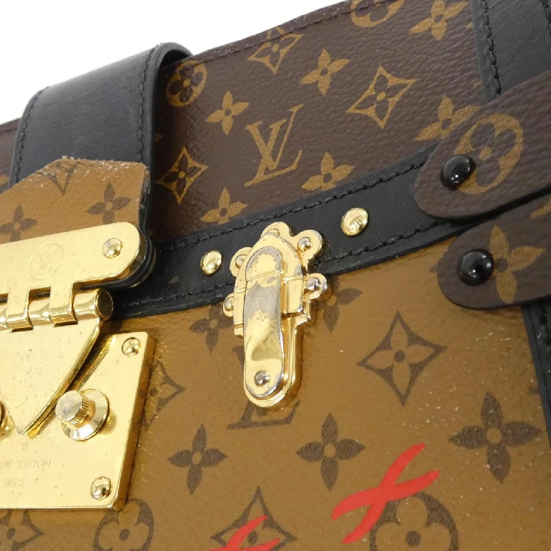 Túi xách đeo vai Louis Vuitton Monogram Reverse Trunk Clutch M43596 611739