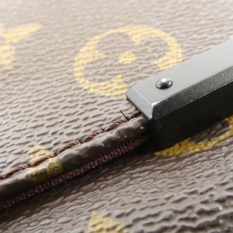 Túi đeo vai Louis Vuitton Monogram Macassar District PM M40935 610077