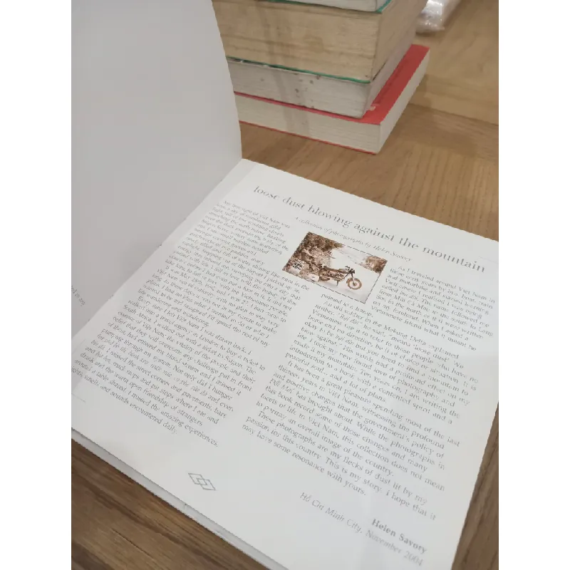 Loose dust blowing against the mountain - Helen Savory 715098