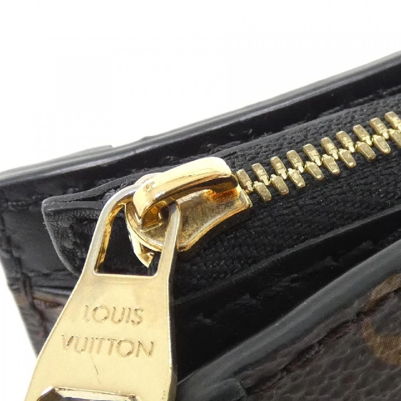 Túi xách đeo vai Louis Vuitton Monogram Reverse Trunk Clutch M43596 - Hàng hiệu Authentic 766815