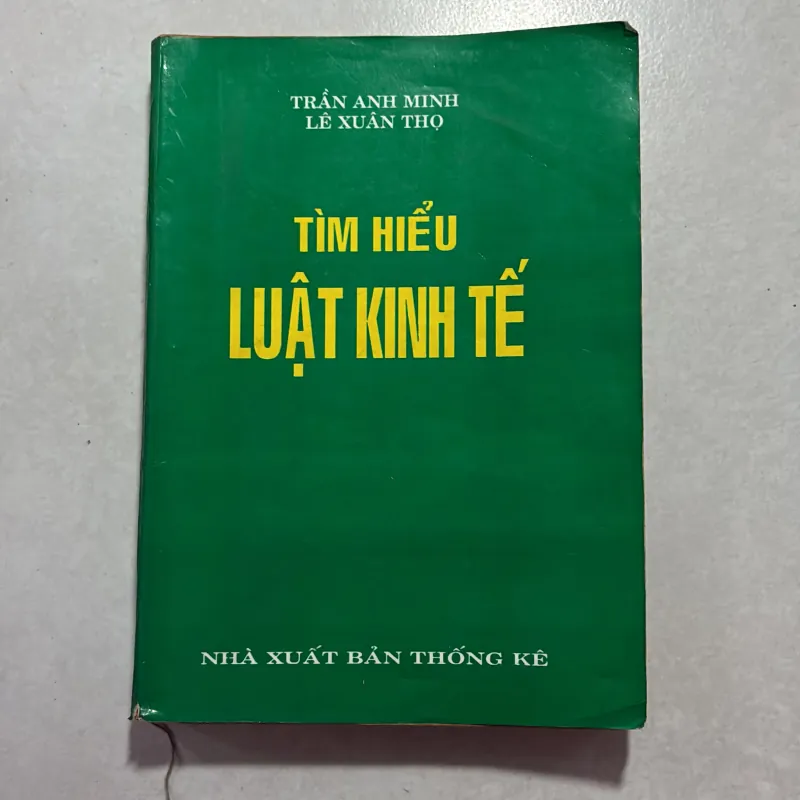 Tìm hiểu luật kinh tế - Trần Anh Minh - 1995s 759424