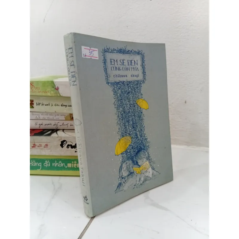 Sách Em sẽ đến cùng cơn mưa 970667