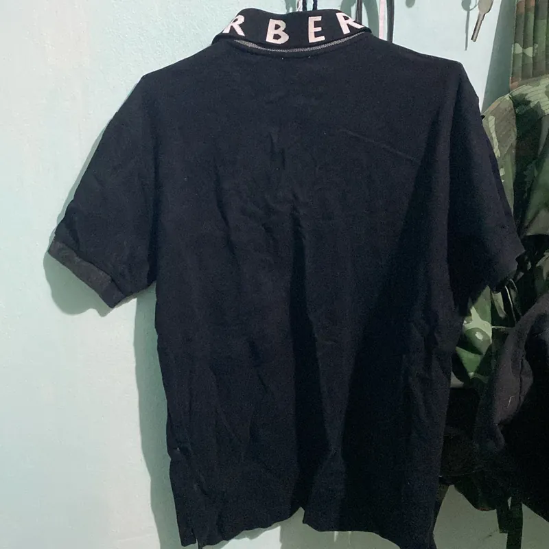 Áo Polo Burberry Size L màu đen  714039
