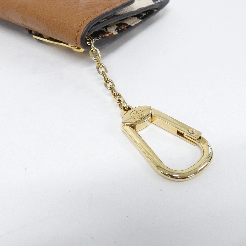 Túi đeo chéo Louis Vuitton Monogram Empreinte (Wild at Heart) Pochette Clé M80692 - Hàng hiệu Authentic 806065