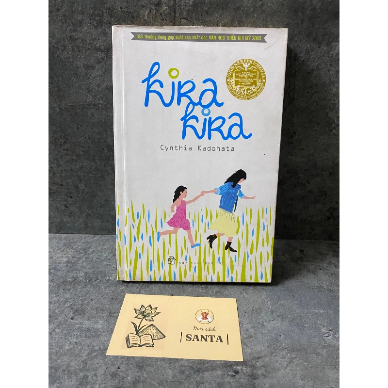 Kira Kira- Cynthia Kdohata- sách lưu kho chưa qua sd, có ố 789563