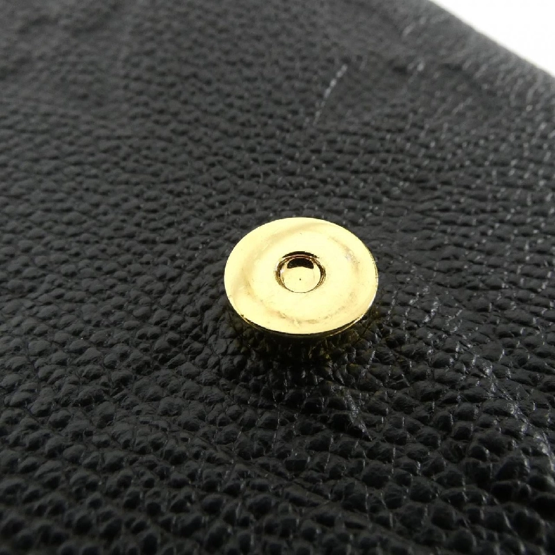 Ba lô Tiny Monogram Empreinte Louis Vuitton M80596 609405