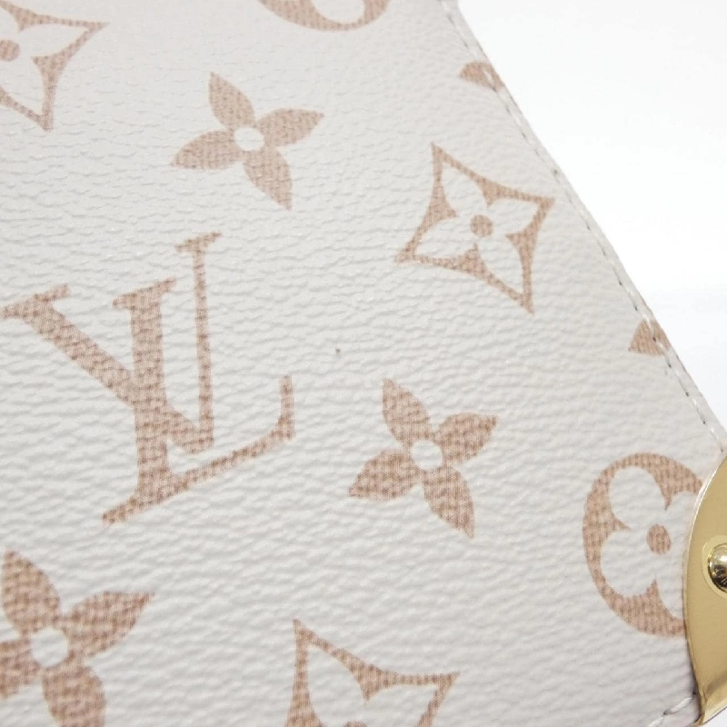 Túi xách vai Louis Vuitton Monogram Dune Noe với charm LV M83227 608607