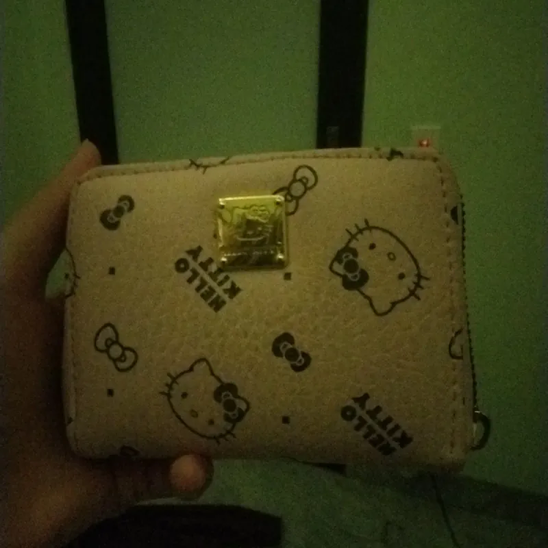 Ví cầm tay Hello Kitty màu hồng nhạt, nhiều ngăn. 949884