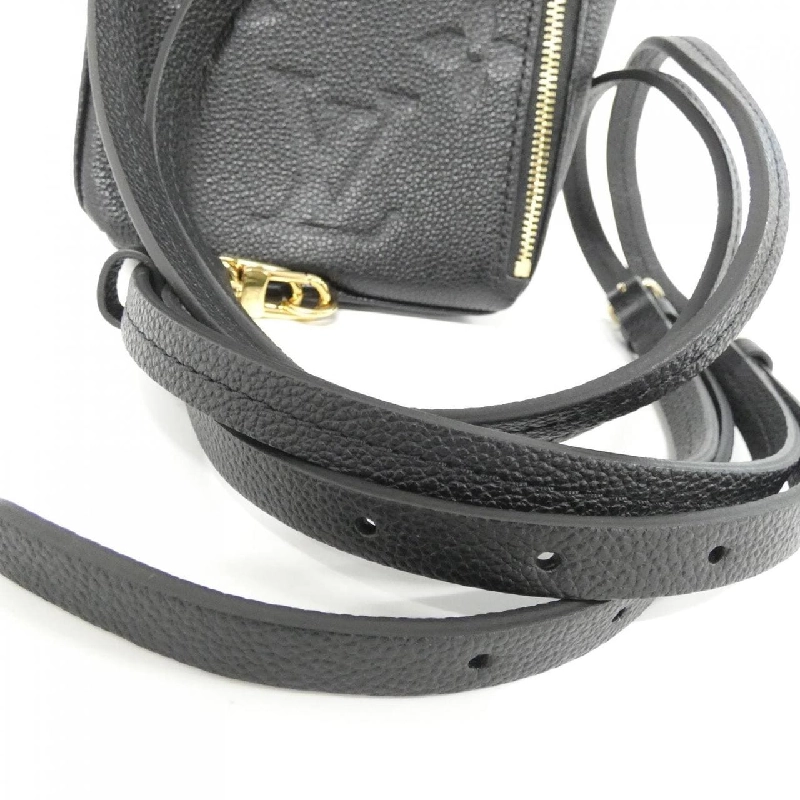 Ba lô Tiny Monogram Empreinte Louis Vuitton M80596 609405