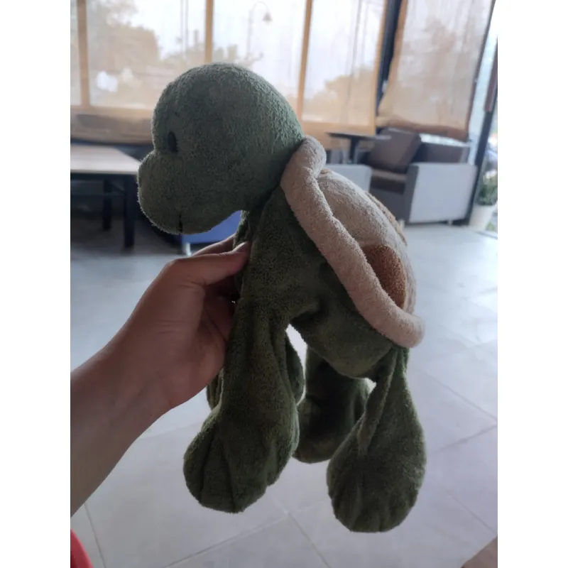 một con thú bông hình rùa màu xanh, có thể thuộc thương hiệu Jellycat,. 
Hàng 2hand 996552