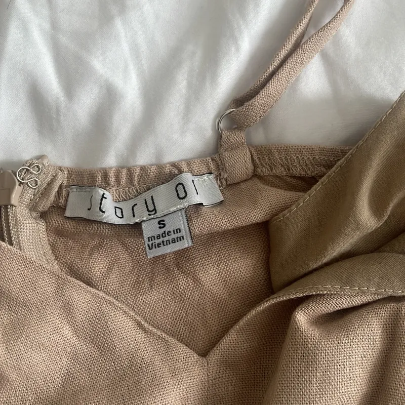 Jumpsuit xẻ đùi 1005499