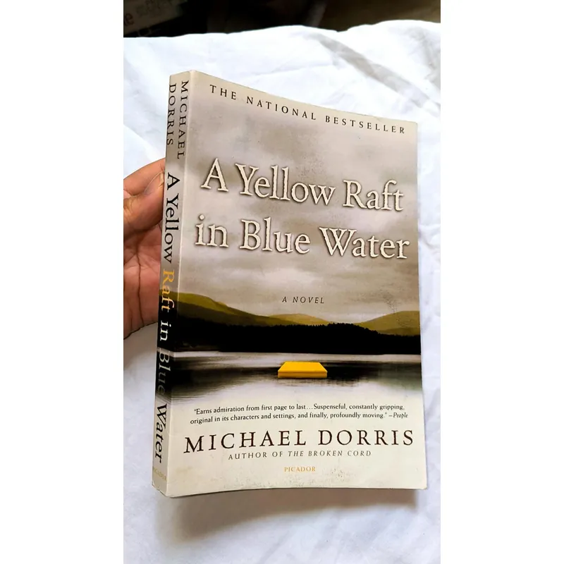 A yellow raft in blue water - Michael Dorris 732638