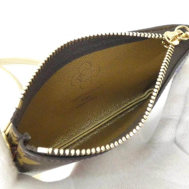 Louis Vuitton Monogram (Vivienne Winter Holiday) Phone Holder M15338 - Hàng hiệu Authentic 808019