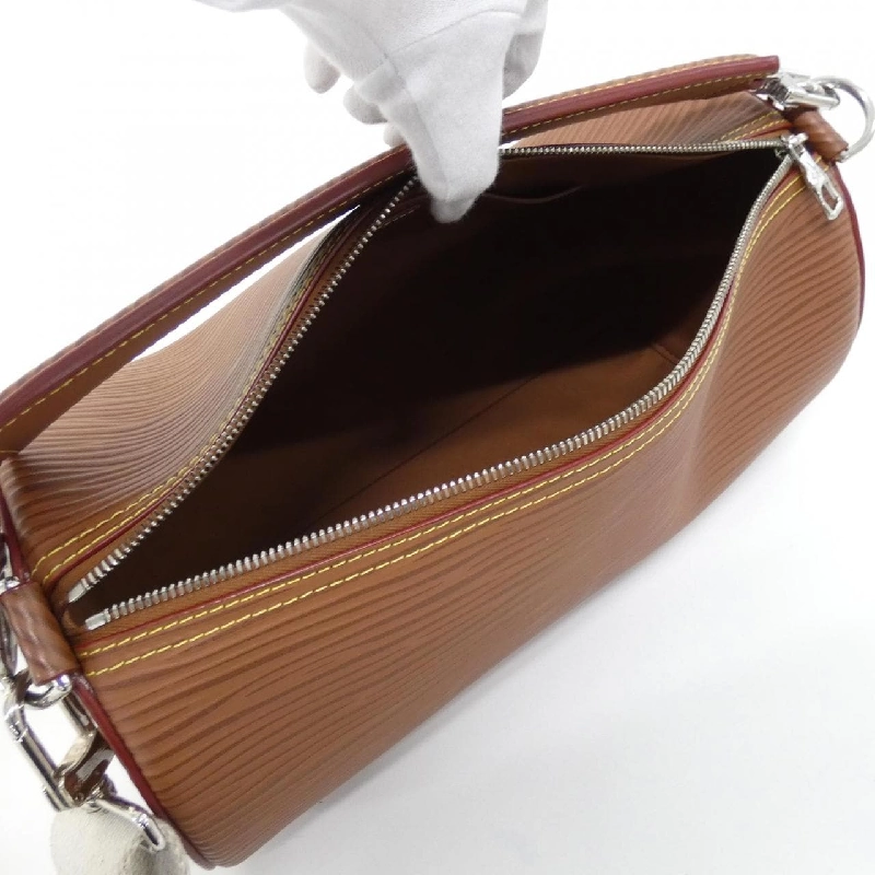 Túi đeo vai Louis Vuitton Epi XL Soft Polochon M23092 608953