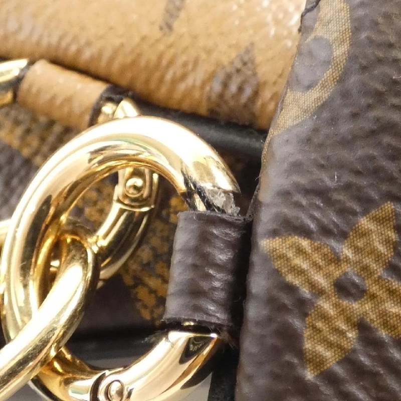 Túi đeo chéo Monogram Trio M68756 623155