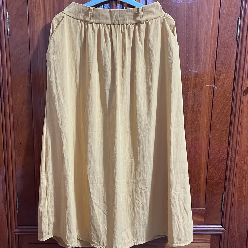 Chân váy vàng size M  720326