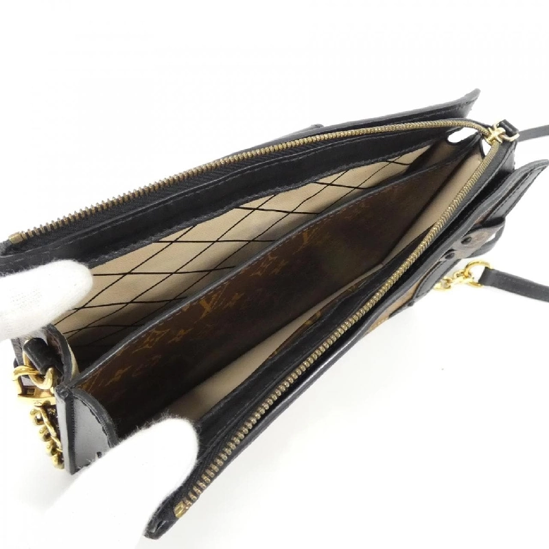 Túi xách đeo vai Louis Vuitton Monogram Reverse Trunk Clutch M43596 611739