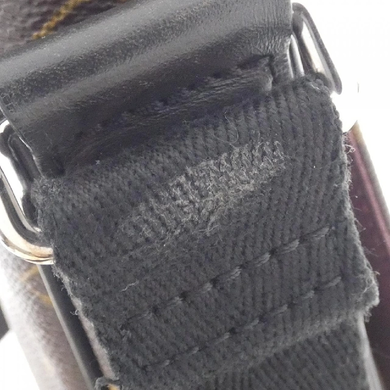 Túi đeo vai Louis Vuitton Monogram Macassar District PM M40935 610077