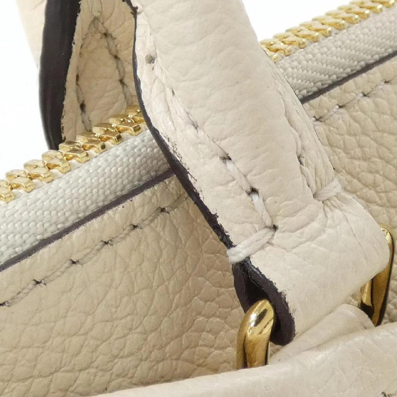 Túi Louis Vuitton Monogram Empreinte Trianon M46503 617686