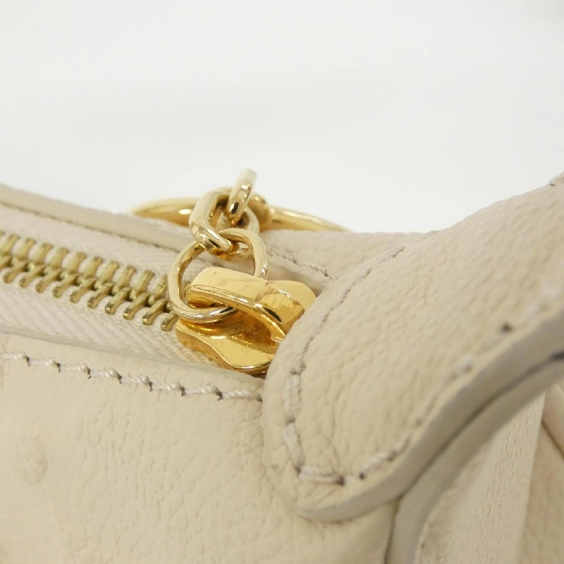 Túi xách vai Louis Vuitton Monogram Empreinte Mini Moon M82519 613540