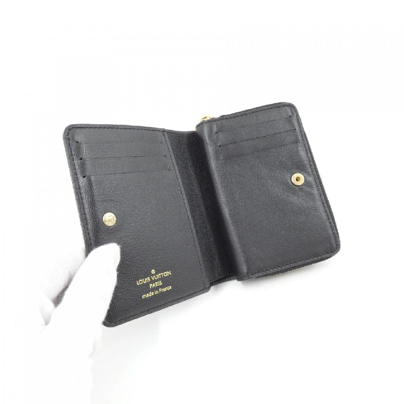 Ví Louis Vuitton Kusson Portefeuille Rue M81599 622282