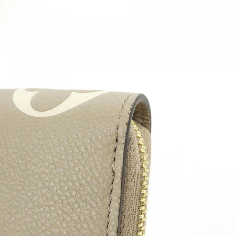 Ví Zippy Monogram Empreinte Hai Màu Louis Vuitton M69794 620990