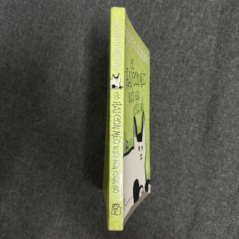 Có hai con mèo ngồi bên cửa sổ - Nguyễn Nhật Ánh 1023041