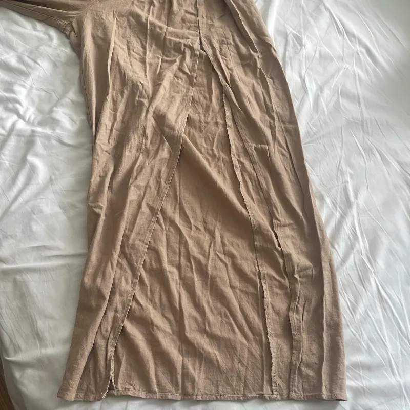 Jumpsuit xẻ đùi 1005499