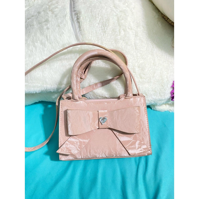 Túi nơ hồng pastel 90% đeo chéo 461792