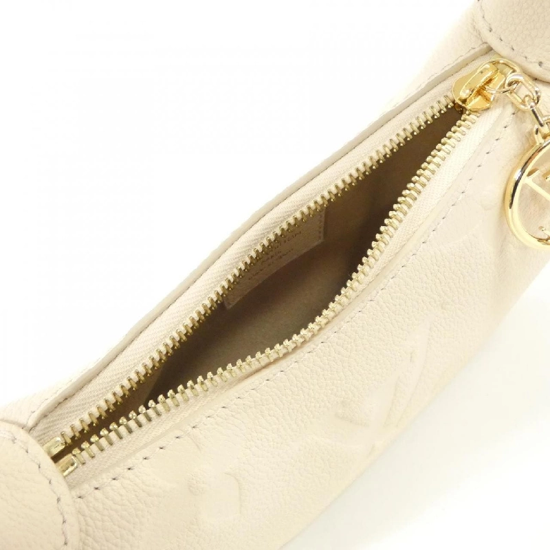 Túi xách vai Louis Vuitton Monogram Empreinte Mini Moon M82519 613540