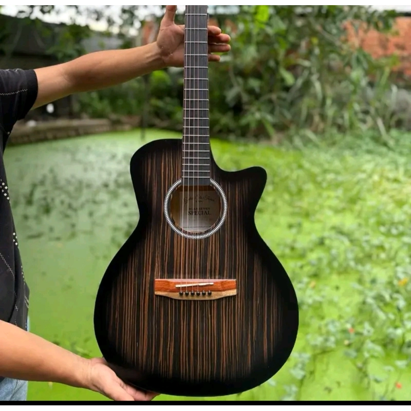 Đàn guitar bằng gỗ (có tặng kèm thêm kẹp đàn và phím gãy đàn) 545611