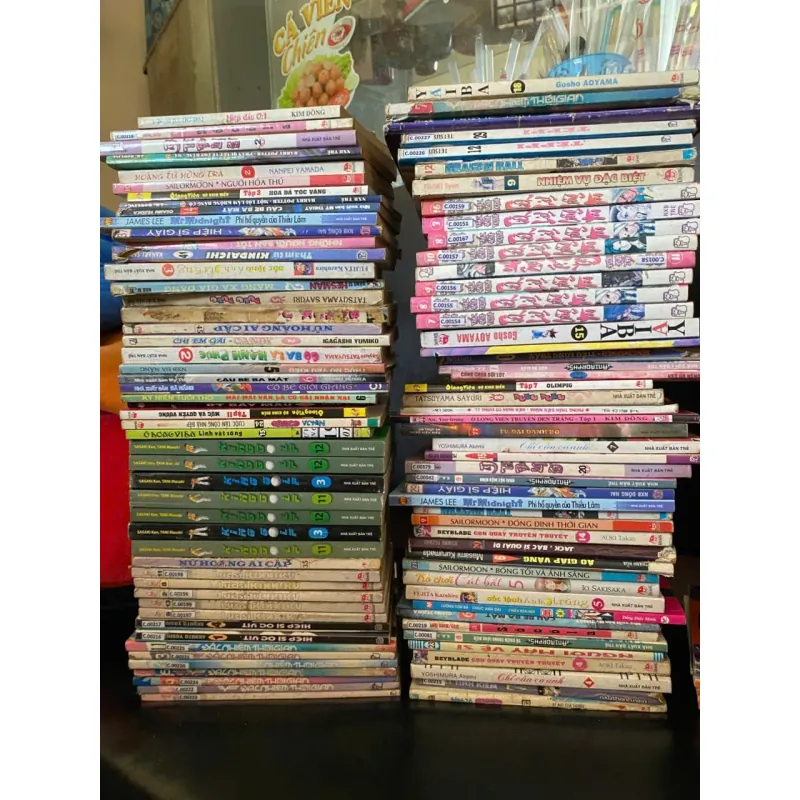 2 chồng truyện tranh như hình . K mất bìa  1010198