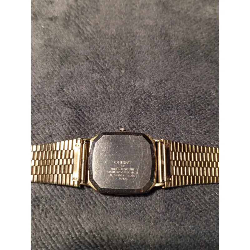 Đồng hồ si nhật bản Orient dáng tank bọc vàng cả dây khoaast 751891